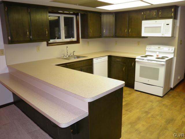 8515 Rextown Road Slatington, PA 18080 - Photo 5 of 14 a kitchen with stainless steel appliances kitchen island a sink dishwasher and stove