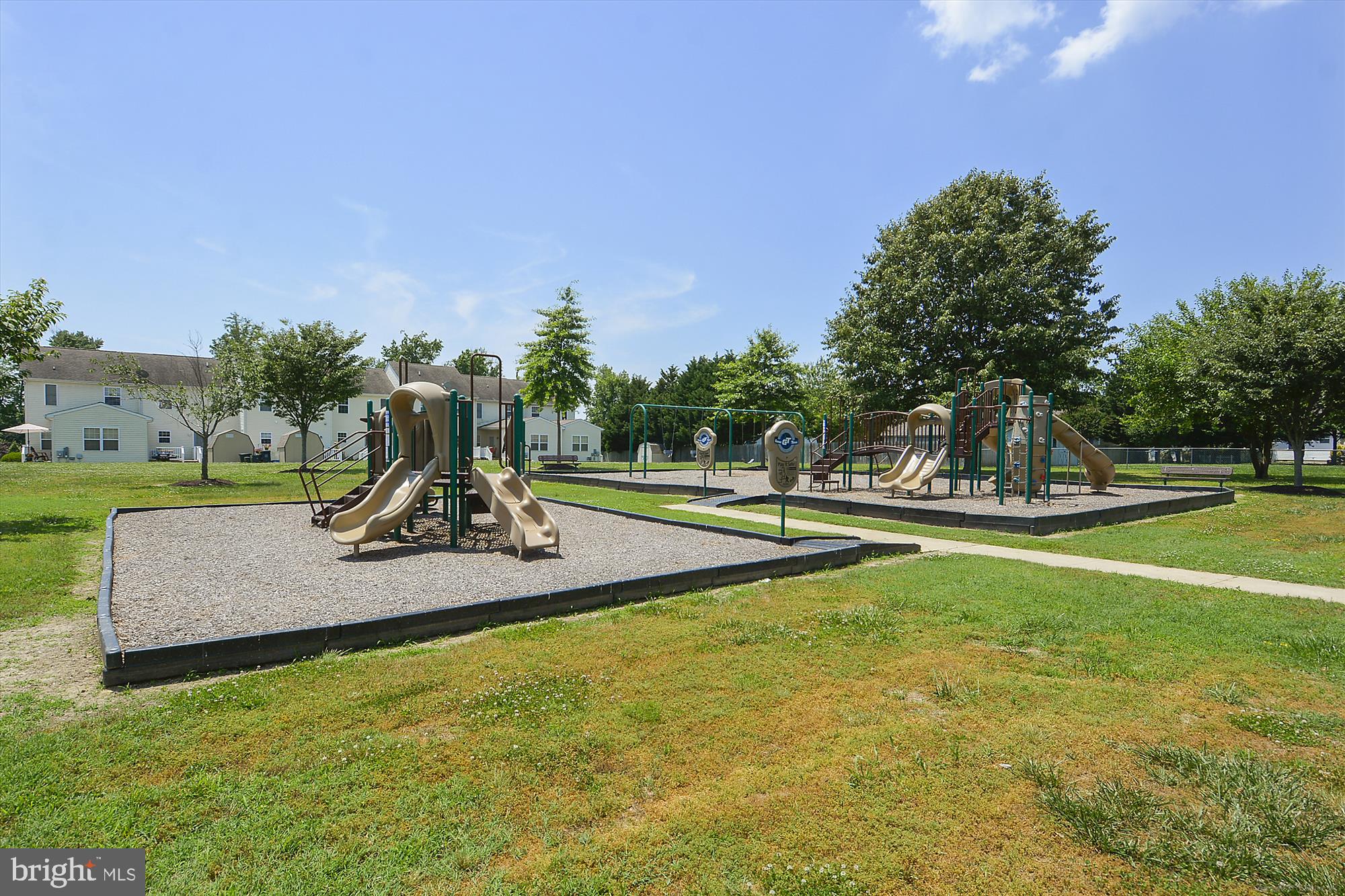 8186 June Way, Unit 203 Easton, MD 21601 - Photo 19 of 22 a view of a park with swings and slides