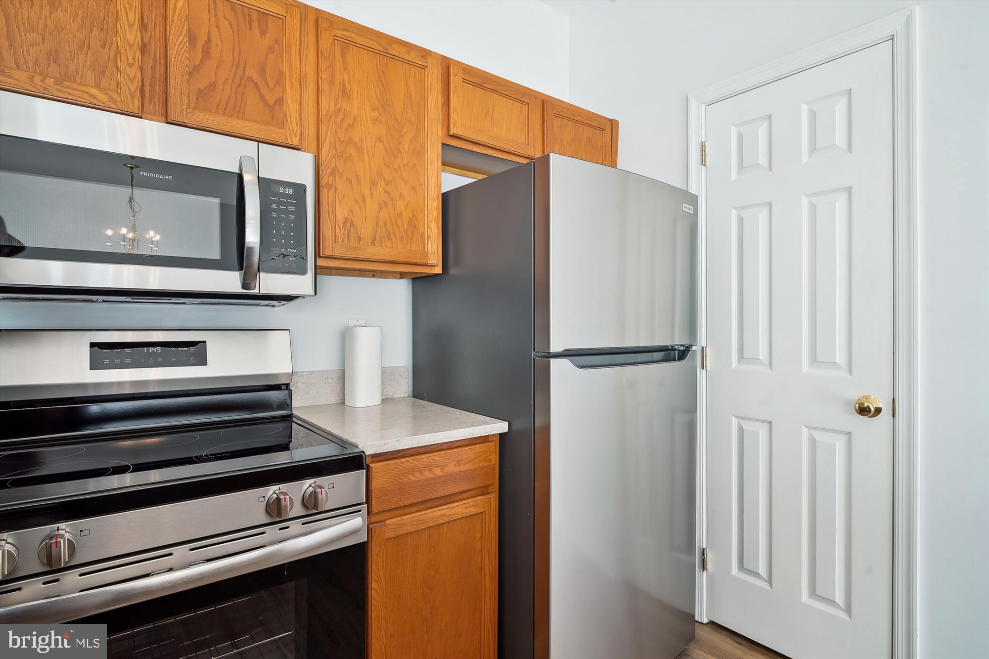 8186 June Way, Unit 203 Easton, MD 21601 - Photo 4 of 22 a kitchen with appliances and a refrigerator