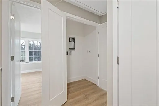 a view of a bathroom from a hallway