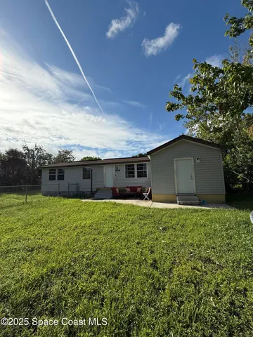 a house view with a garden space
