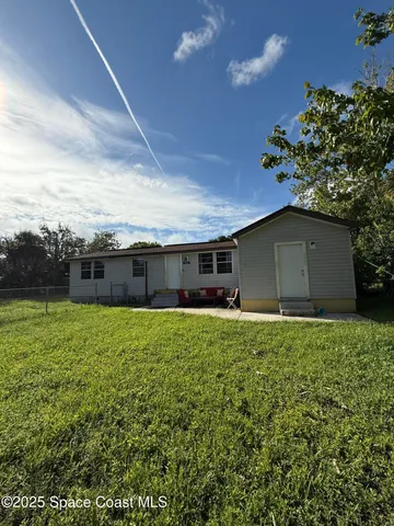 a house view with a garden space