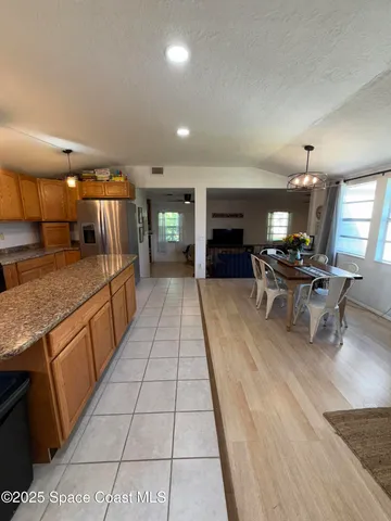a kitchen with stainless steel appliances granite countertop a sink counter space and cabinets