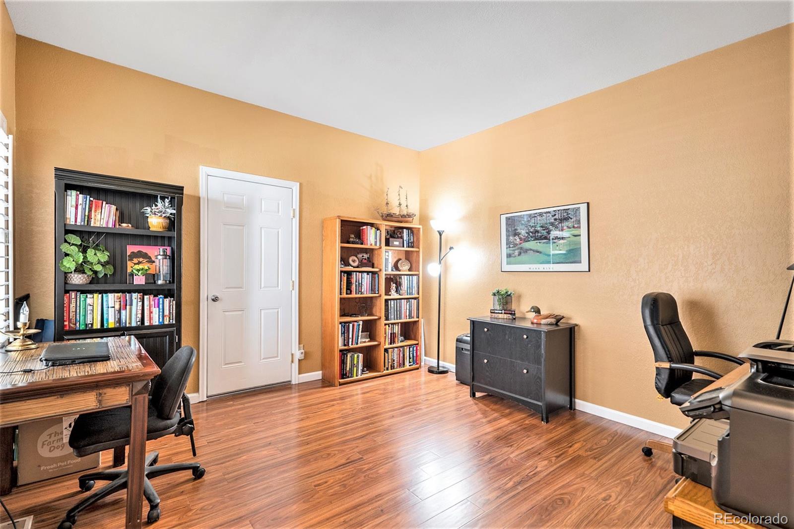 9875 Greensview Circle Lone Tree, CO 80124 - Photo 15 of 19 a view of a workspace with furniture and wooden floor