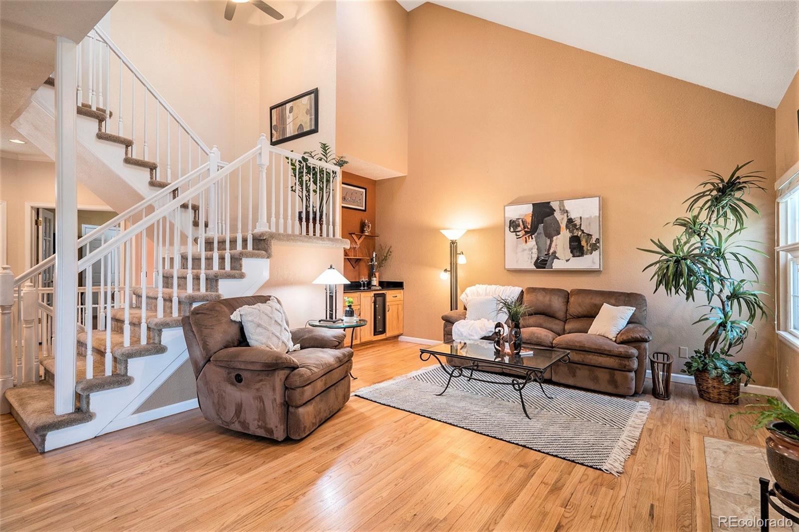 9875 Greensview Circle Lone Tree, CO 80124 - Photo 4 of 19 a living room with furniture and a wooden floor