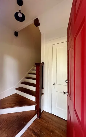 a view of entryway with wooden floor and window