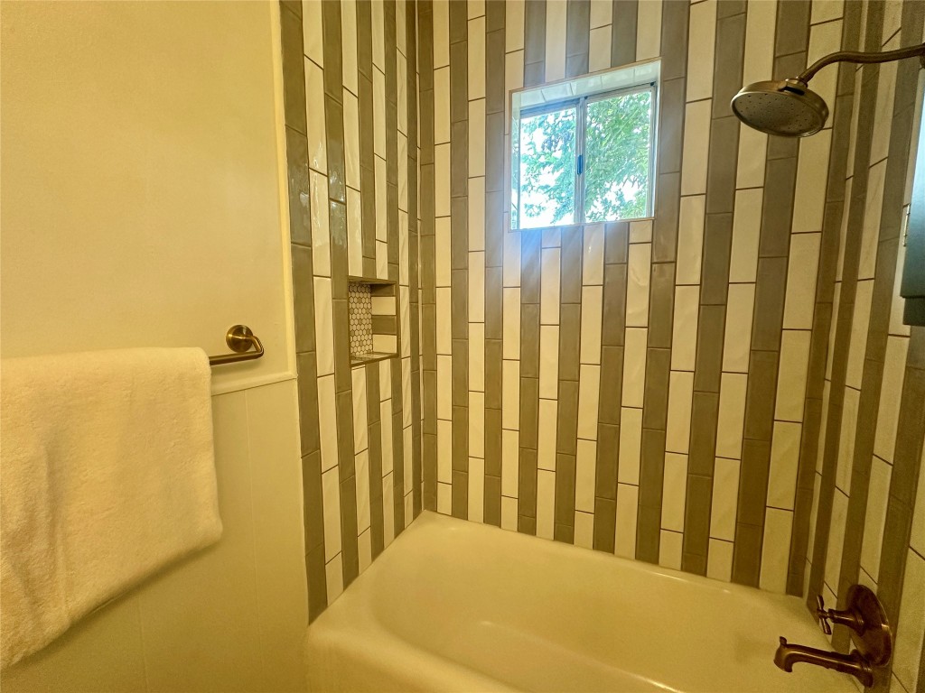 1700 Houston Street, Unit 201 Austin, TX 78756 - Photo 12 of 26 a view of a bathroom with a tub