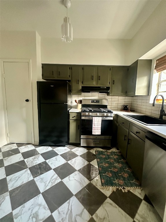 1700 Houston Street, Unit 201 Austin, TX 78756 - Photo 14 of 26 a kitchen with stainless steel appliances granite countertop a refrigerator and a stove top oven