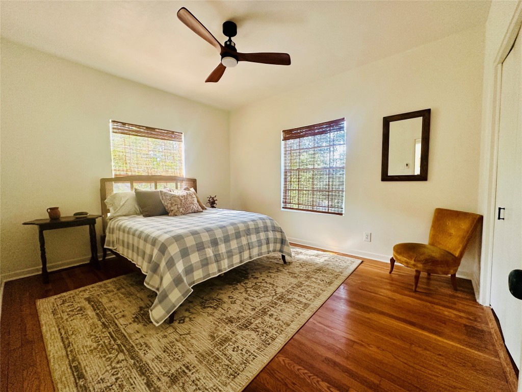 1700 Houston Street, Unit 201 Austin, TX 78756 - Photo 19 of 26 a bedroom with a bed a couch and a window