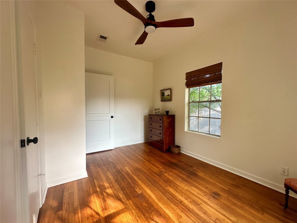1700 Houston Street, Unit 201 Austin, TX 78756 - Photo 24 of 26 a bedroom with a bed and a window