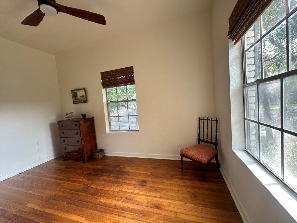 1700 Houston Street, Unit 201 Austin, TX 78756 - Photo 25 of 26 a view of a room with furniture a flat screen tv and wooden floor