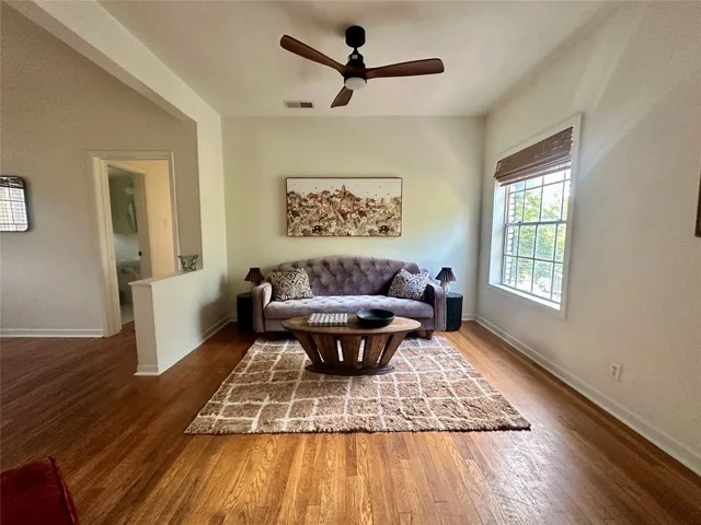 a living room with couch and a window