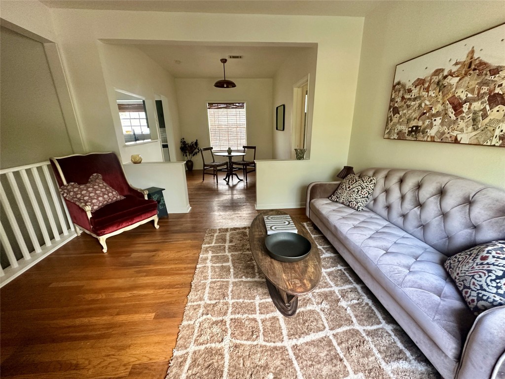 1700 Houston Street, Unit 201 Austin, TX 78756 - Photo 8 of 26 a living room with furniture and wooden floor