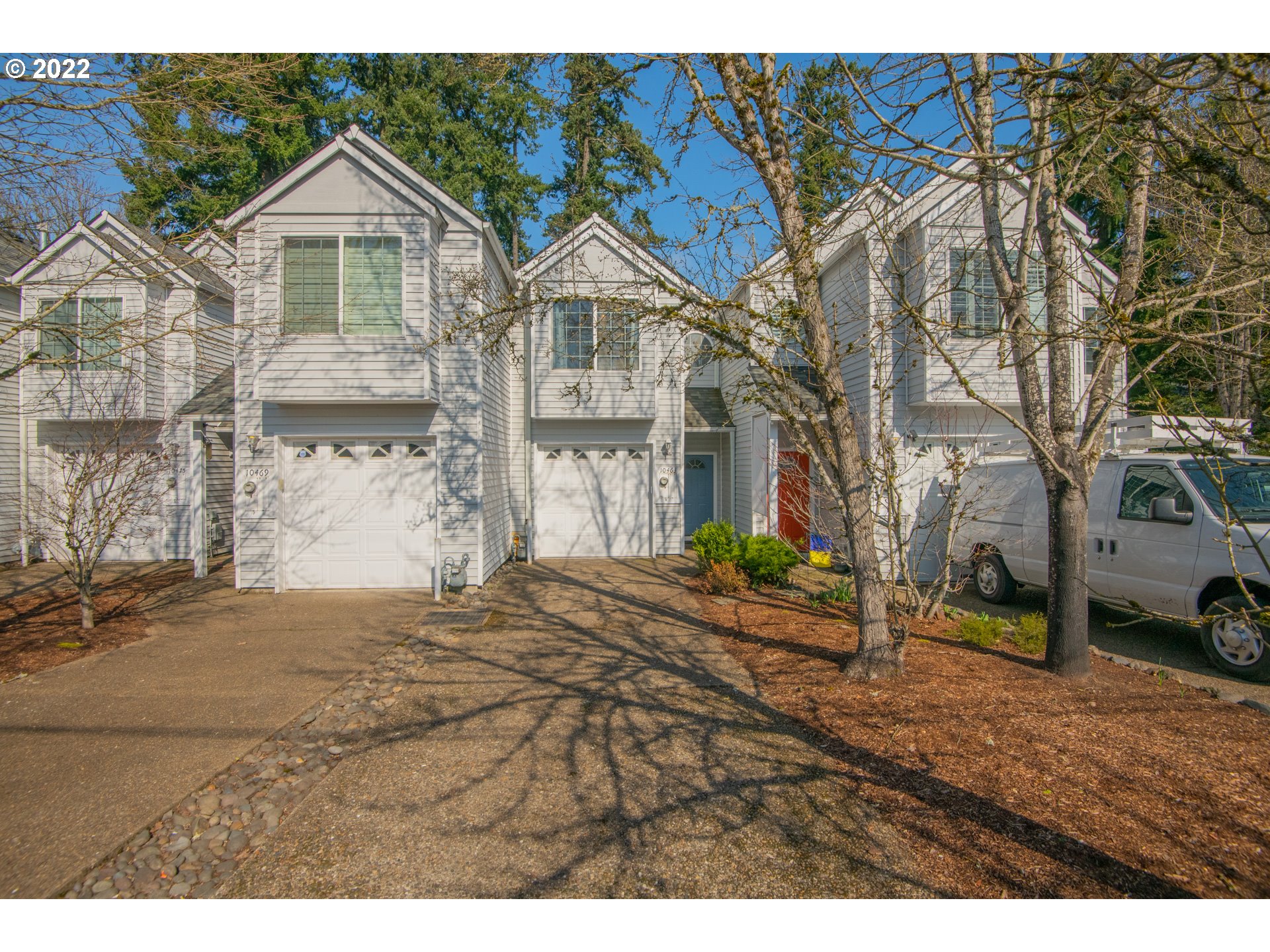 10463 Southwest Laurel Road Beaverton, OR 97005 - Photo 1 of 28 a view of multiple houses with a yard