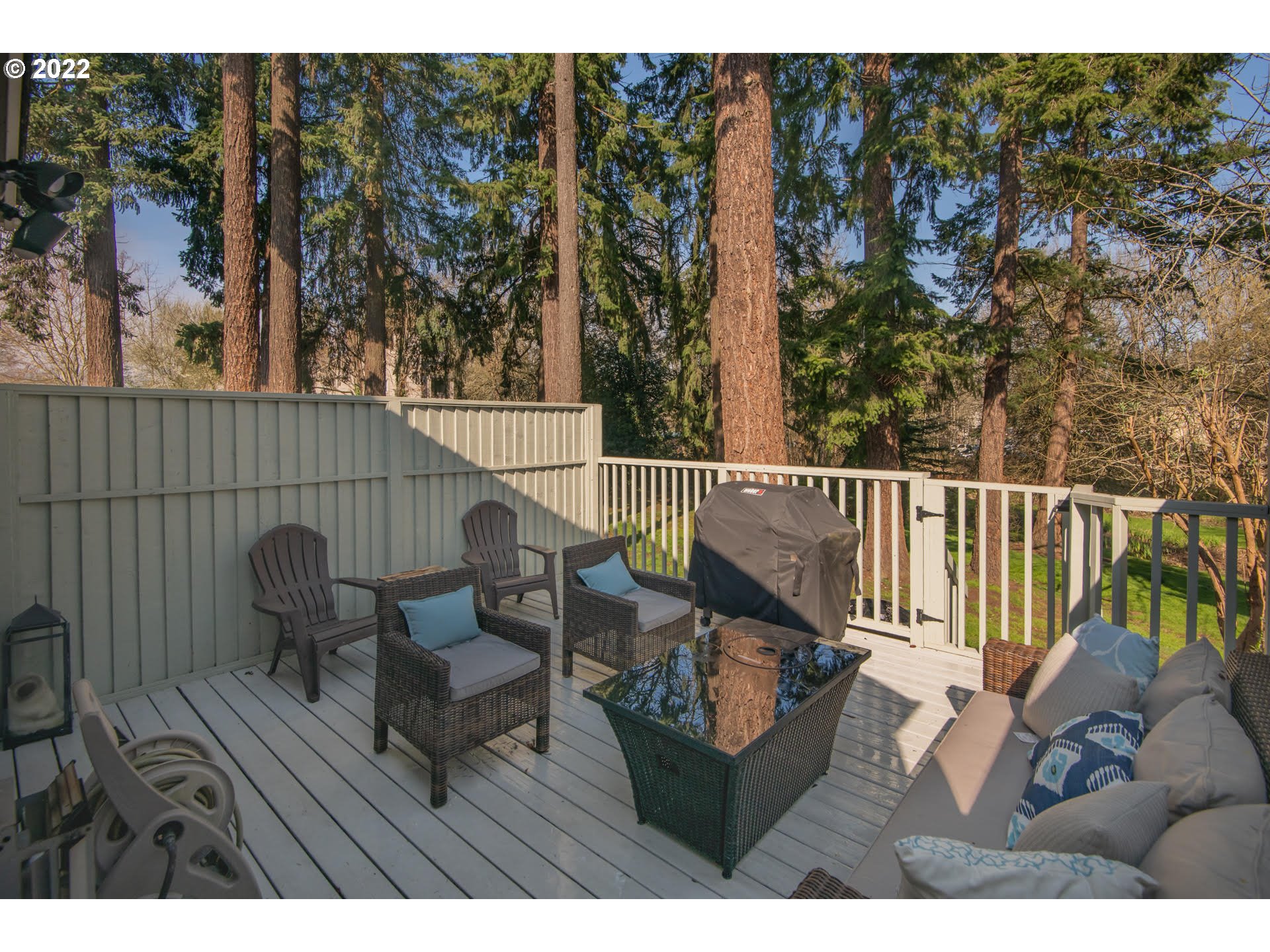 10463 Southwest Laurel Road Beaverton, OR 97005 - Photo 11 of 28 a view of a chairs and table on the deck