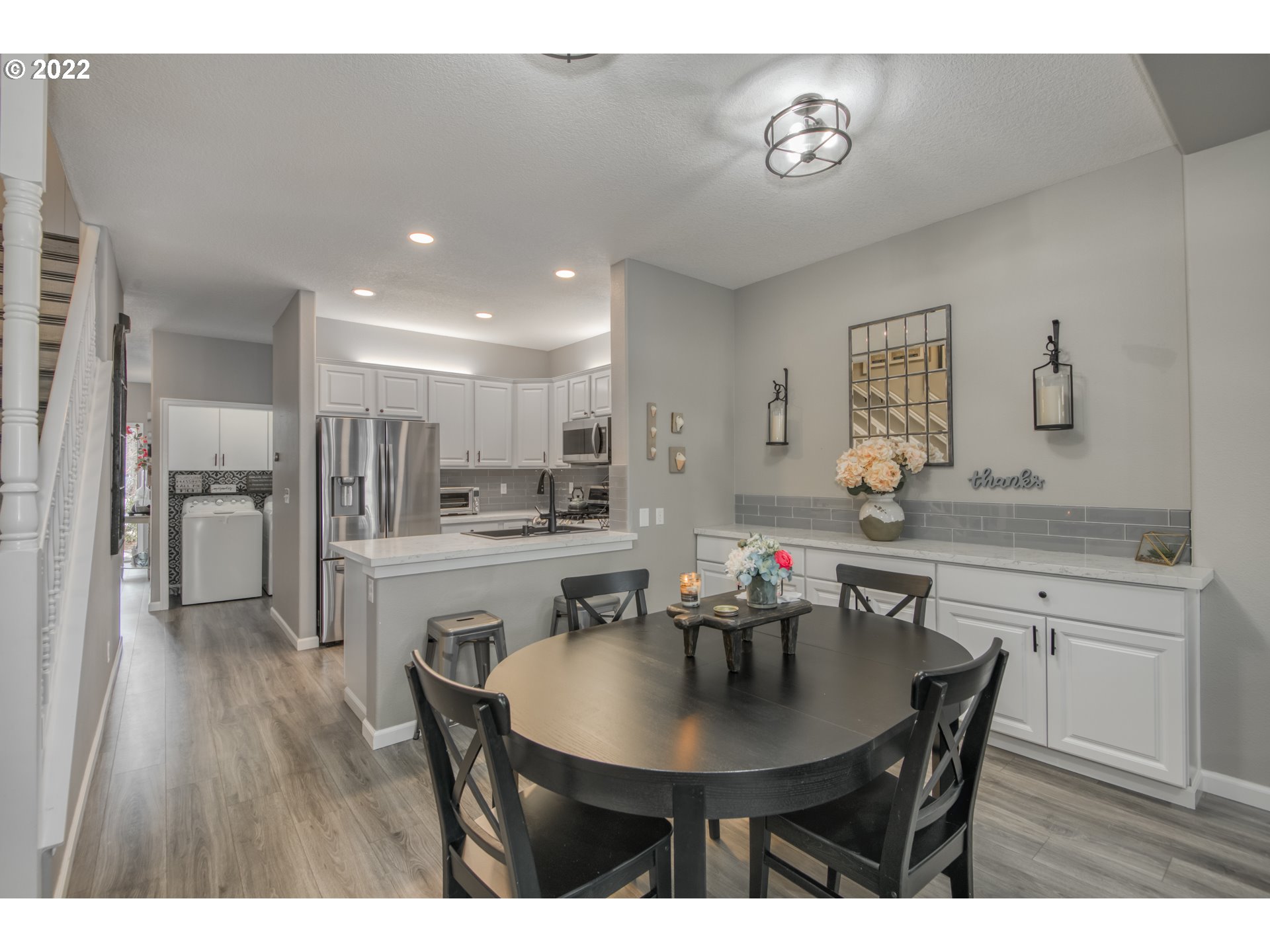 10463 Southwest Laurel Road Beaverton, OR 97005 - Photo 15 of 28 a kitchen with a table and chairs