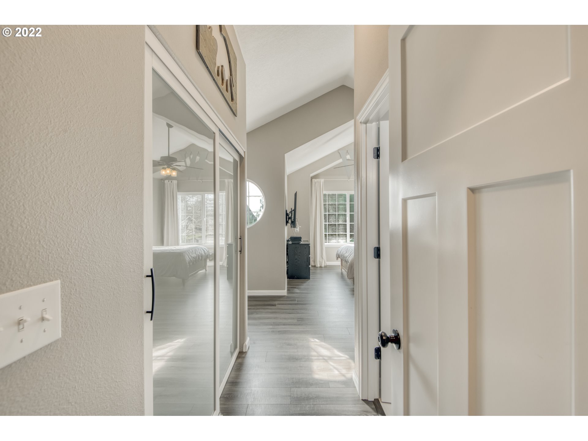 10463 Southwest Laurel Road Beaverton, OR 97005 - Photo 21 of 28 a view of a hallway with wooden floor and staircase