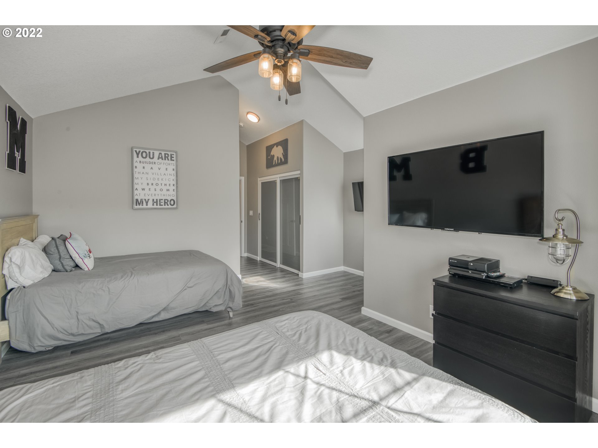 10463 Southwest Laurel Road Beaverton, OR 97005 - Photo 24 of 28 a bedroom with a bed and a flat screen tv