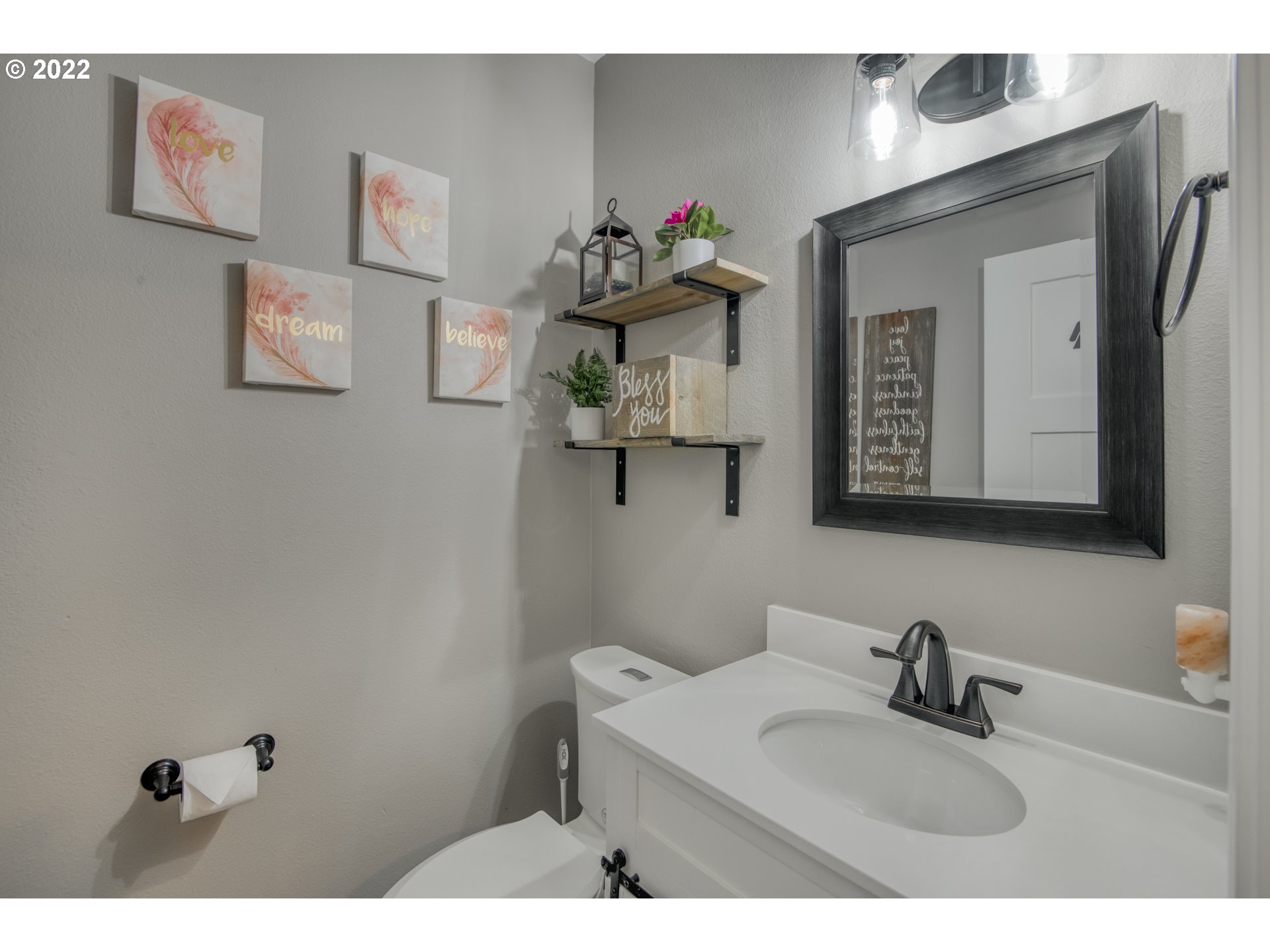 10463 Southwest Laurel Road Beaverton, OR 97005 - Photo 5 of 28 a bathroom with a sink vanity and mirror