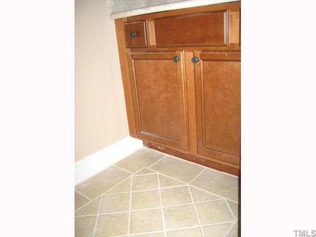 5846 Shady Grove Circle Raleigh, NC 27609 - Photo 6 of 10 First floor powder room with new tile floor