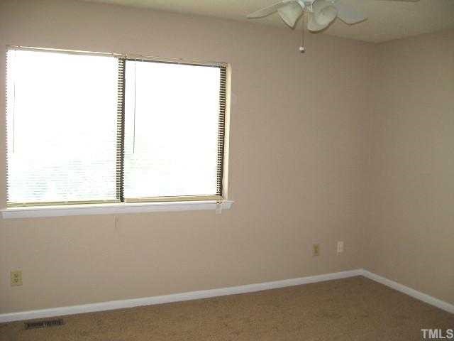5846 Shady Grove Circle Raleigh, NC 27609 - Photo 7 of 10 Master bedroom with ceiling fan & two closets