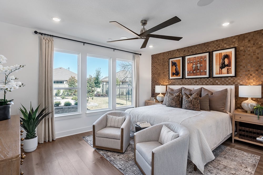 1509 Caylea Blf Lane Georgetown, TX 78628 - Photo 13 of 30 a bedroom with a large bed and a couch