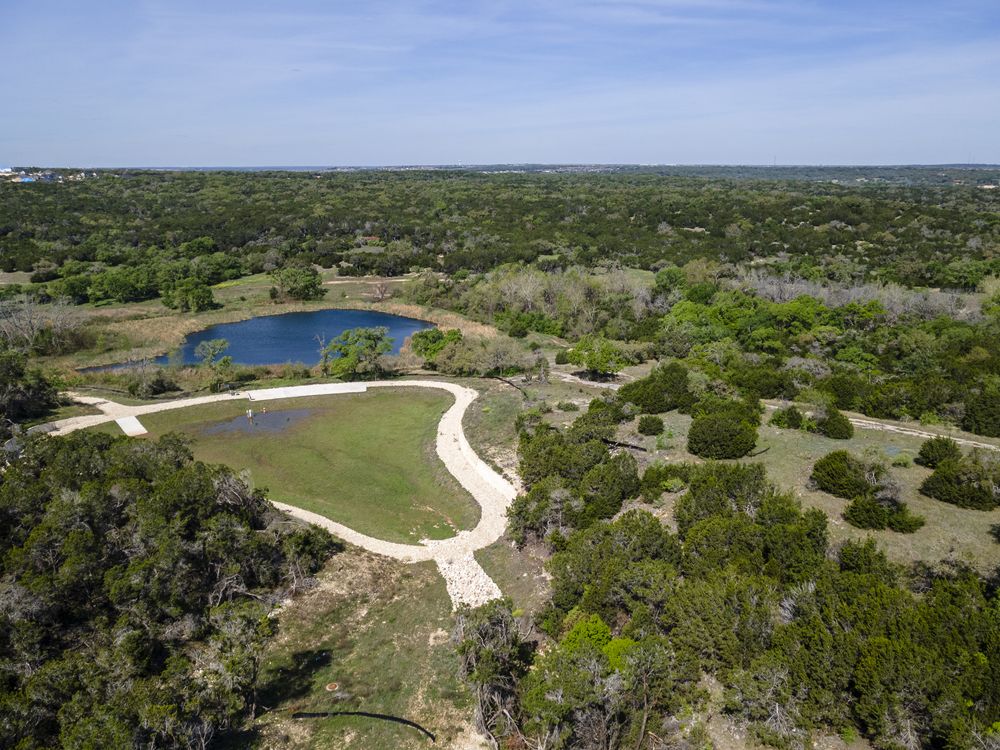 1509 Caylea Blf Lane Georgetown, TX 78628 - Photo 27 of 30 a view of a lake with a city