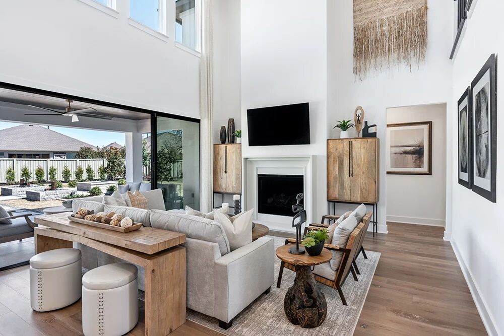 1509 Caylea Blf Lane Georgetown, TX 78628 - Photo 10 of 30 a living room with furniture a fireplace and a flat screen tv