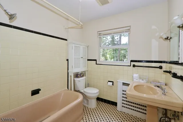 a bathroom with a sink toilet a shower and bathtub