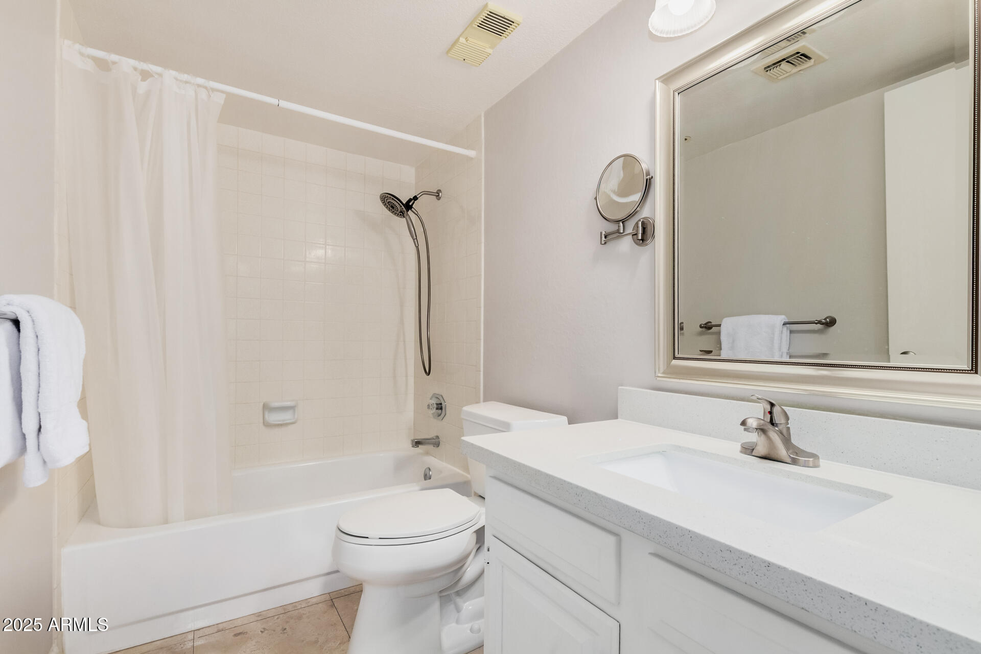 7970 East Camelback Road, Unit 611 Scottsdale, AZ 85251 - Photo 12 of 20 a bathroom with a granite countertop sink toilet and shower