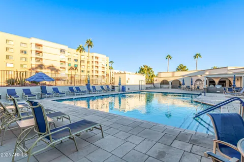 a view of swimming pool with outdoor seating
