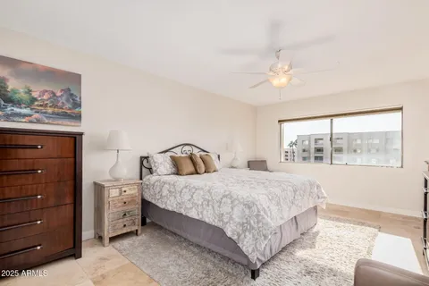 a bedroom with a large bed and a window