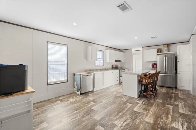 a view of a kitchen and dining room