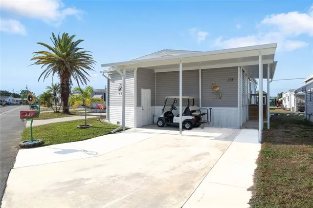 a view of a house with outdoor space and porch