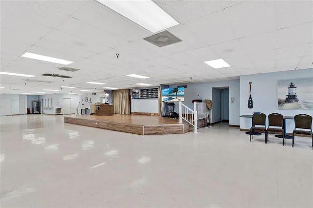 a view of a livingroom with furniture and a window