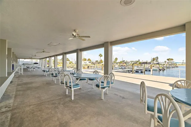 a very nice looking living room with a large window and furniture