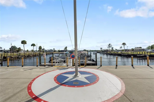a swimming pool with outdoor seating and city view