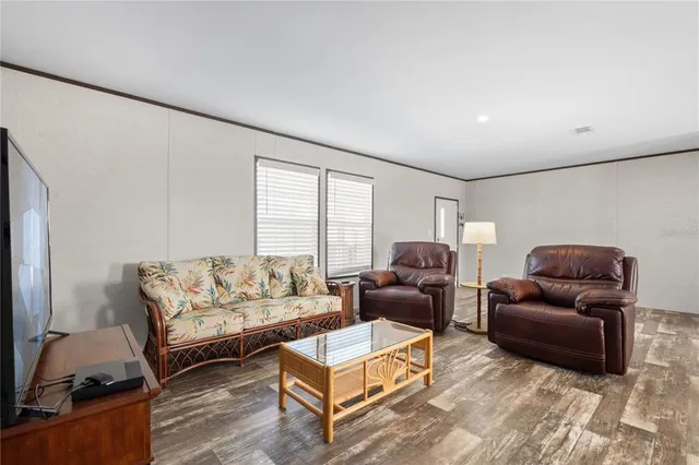 a living room with furniture and a window