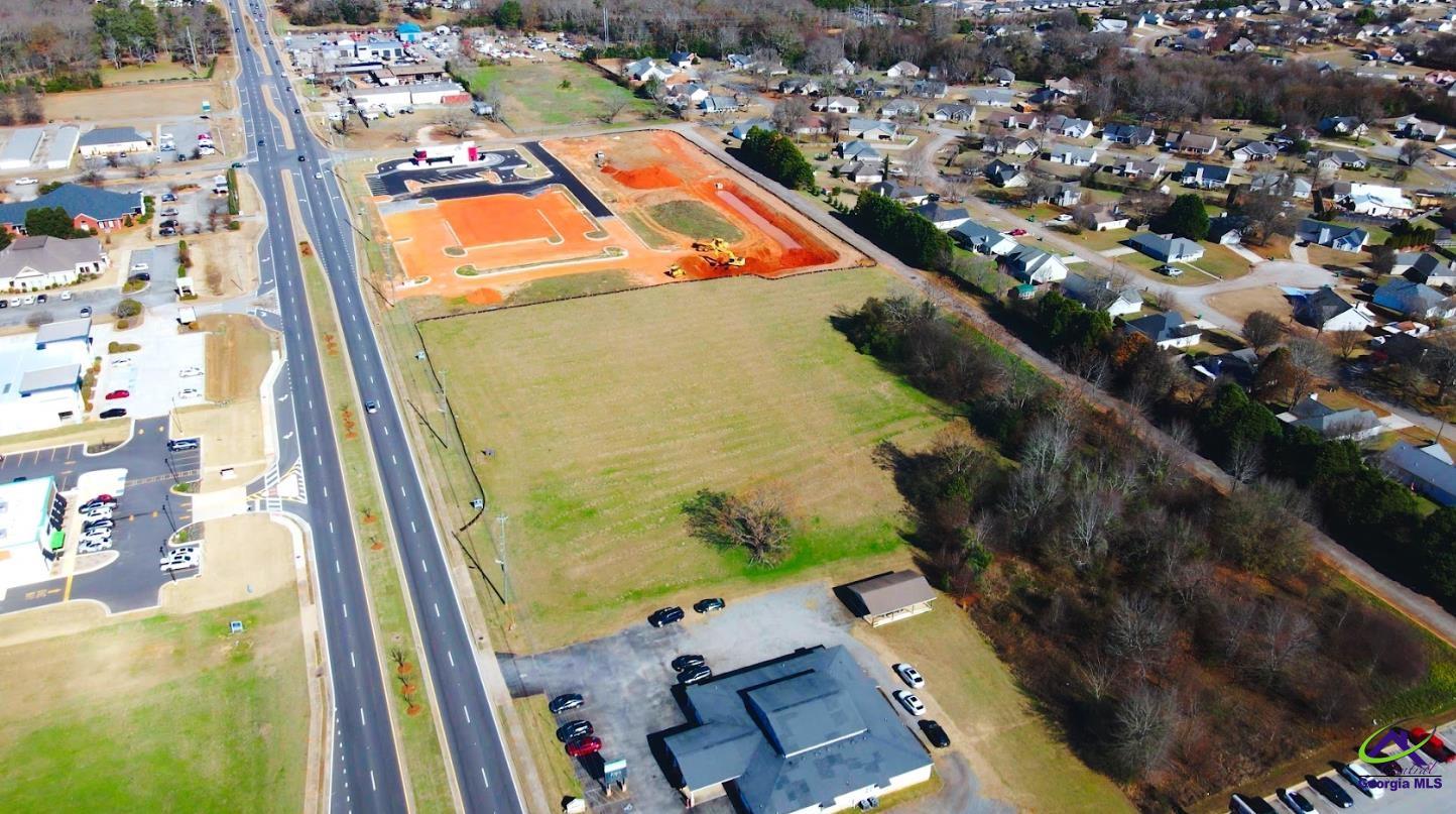 1278 South Houston Lake Road Warner Robins, GA 31088 - Photo 2 of 4 an aerial view of residential houses with outdoor space