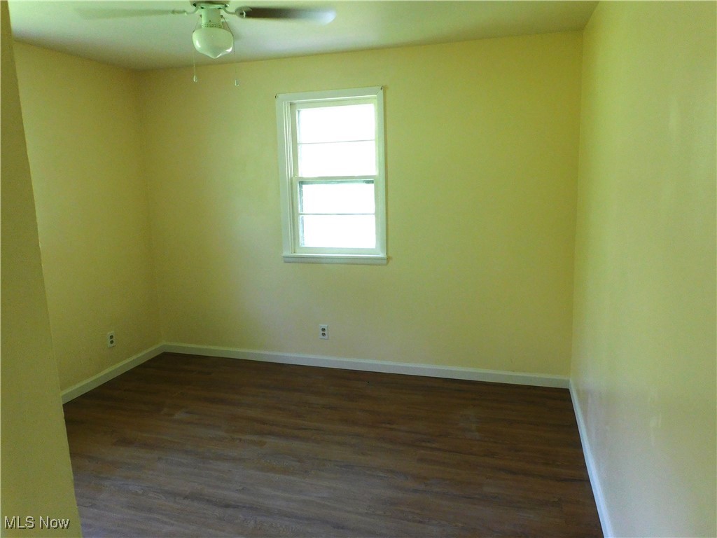 339 Johnson Plank Road Warren, OH 44481 - Photo 21 of 29 BR 2 A featuring dark wood-style flooring, baseboards, and a ceiling fan