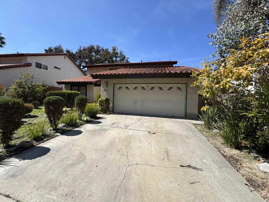 2845 Cottingham Street Oceanside, CA 92054 - Photo 2 of 11 a front view of a house with a yard