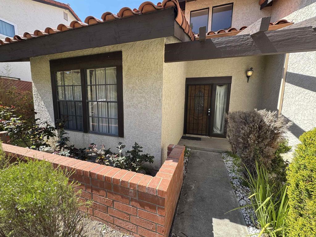 2845 Cottingham Street Oceanside, CA 92054 - Photo 3 of 11 a front view of a house with a yard