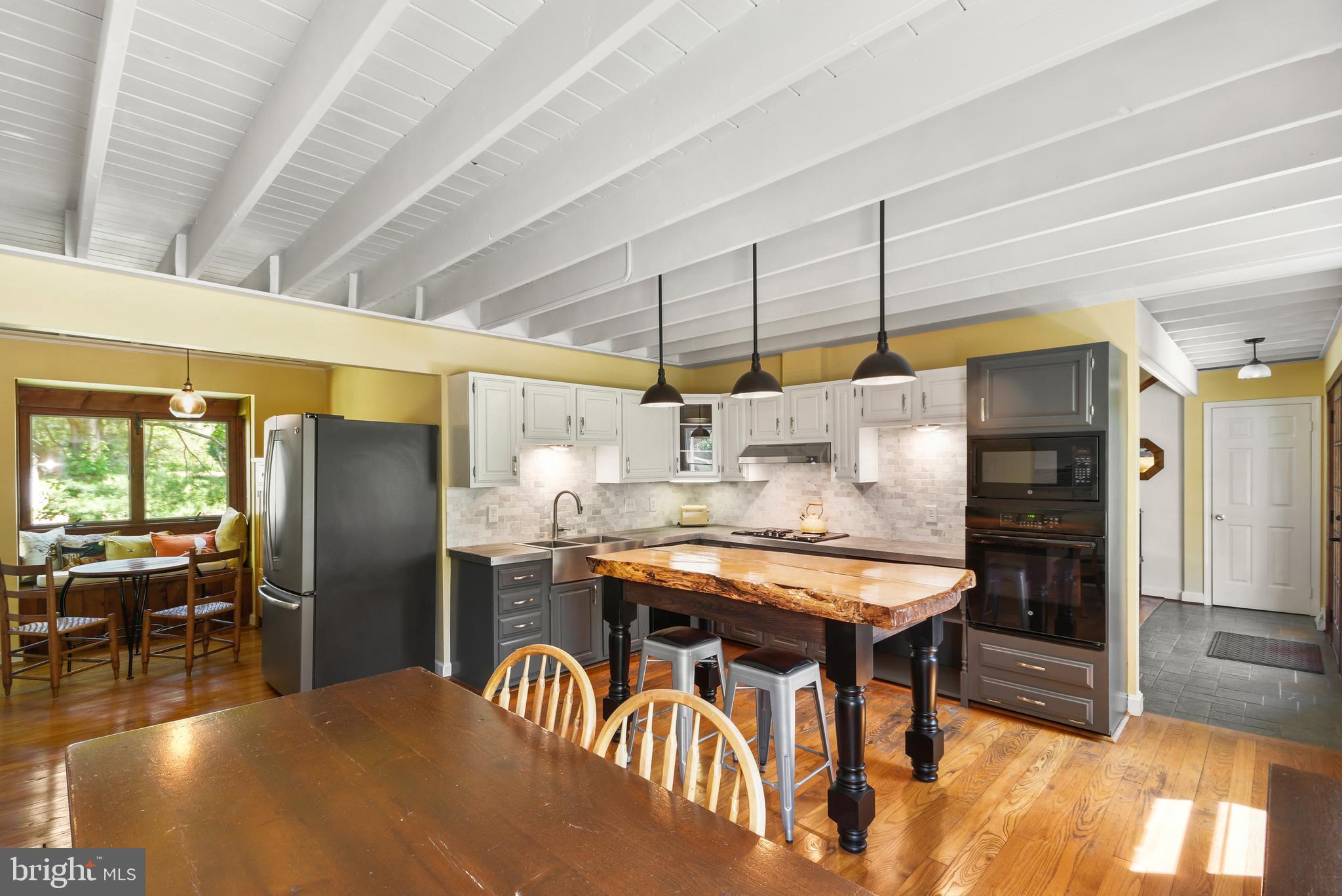 Updated kitchen with exposed beams...