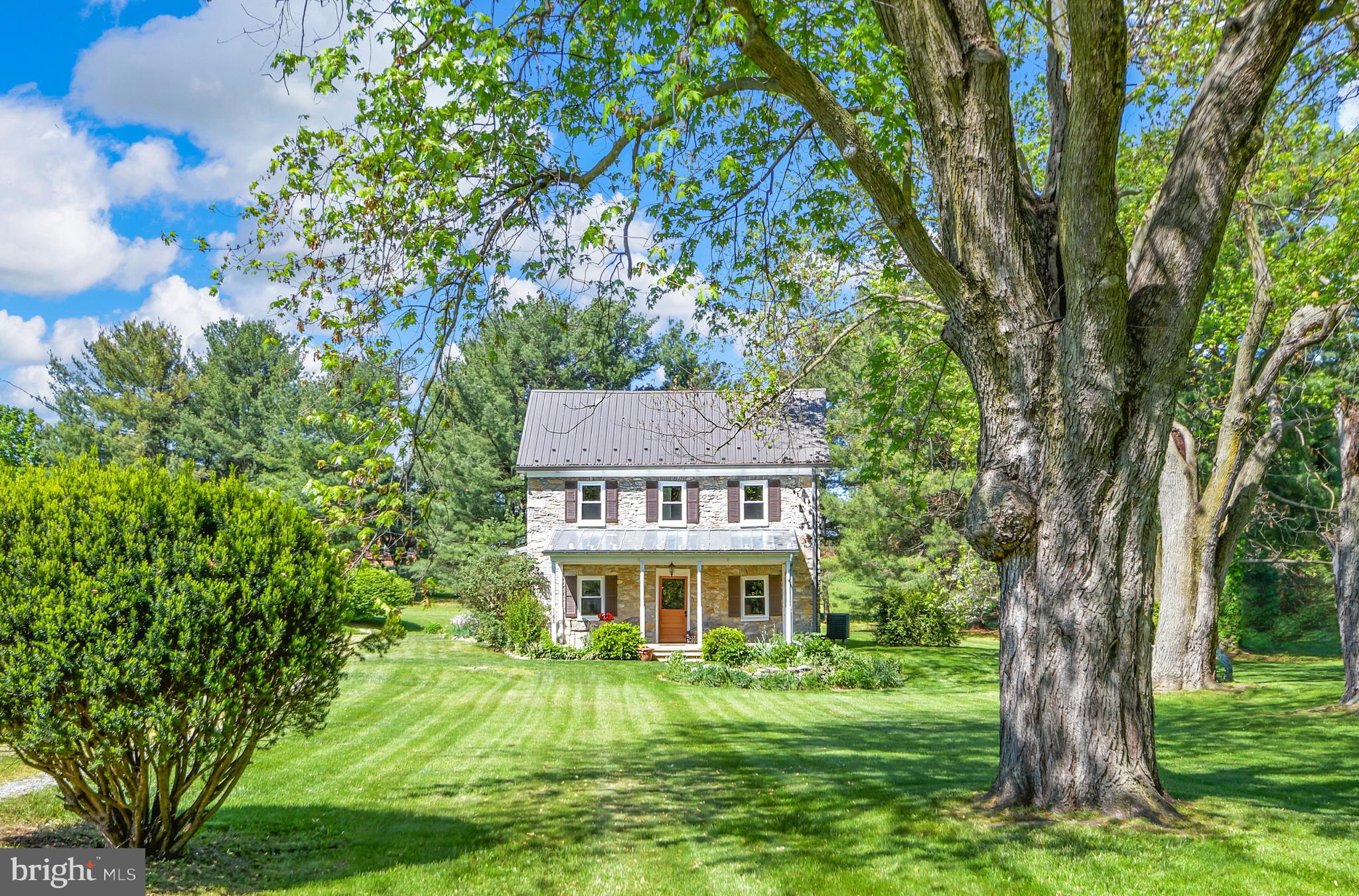 11628 White Hall Road Smithsburg, MD 21783 - Photo 10 of 111 Lush landscaping frames the home