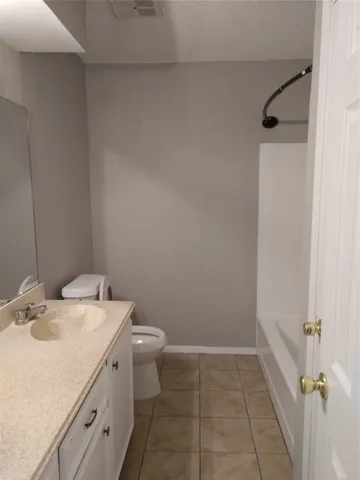a bathroom with a sink toilet and tub
