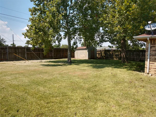 a swimming pool with trees in front of it