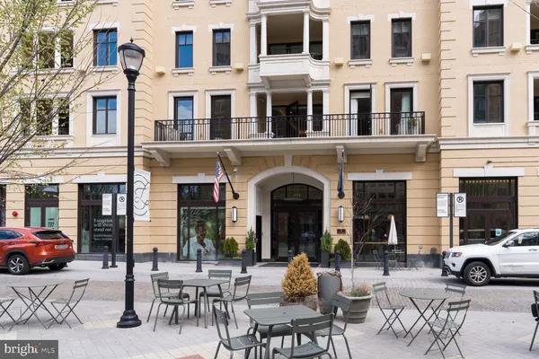 a view of a brick building with many windows