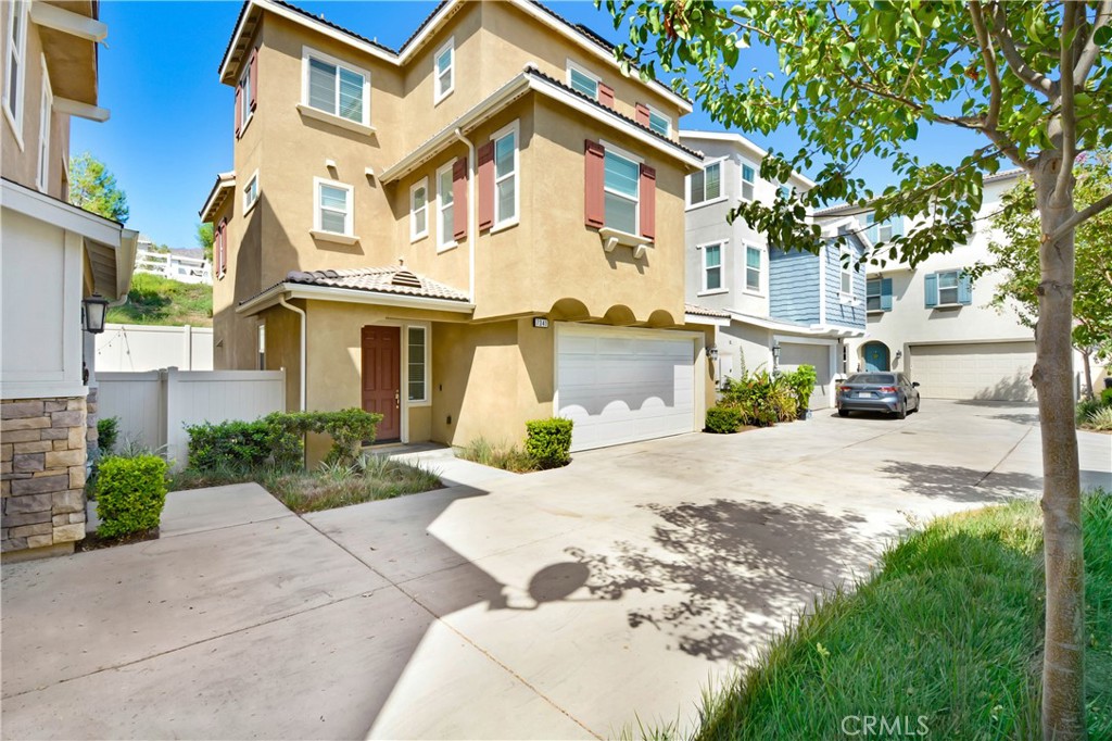 7341 Garnet Ridge Road Jurupa Valley, CA 92509 - Photo 1 of 1 a view of a white house with a yard and plants