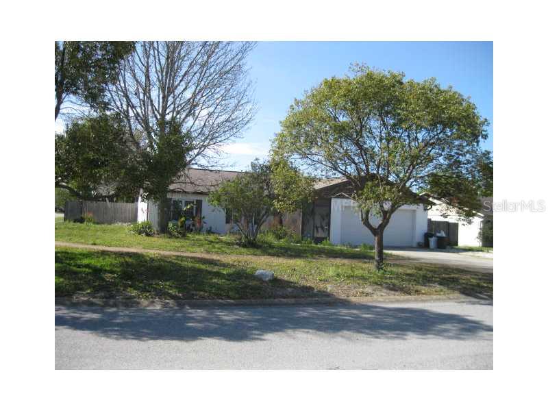 12226 Shadow Ridge Boulevard Hudson, FL 34669 - Photo 1 of 1 a view of a house with a yard