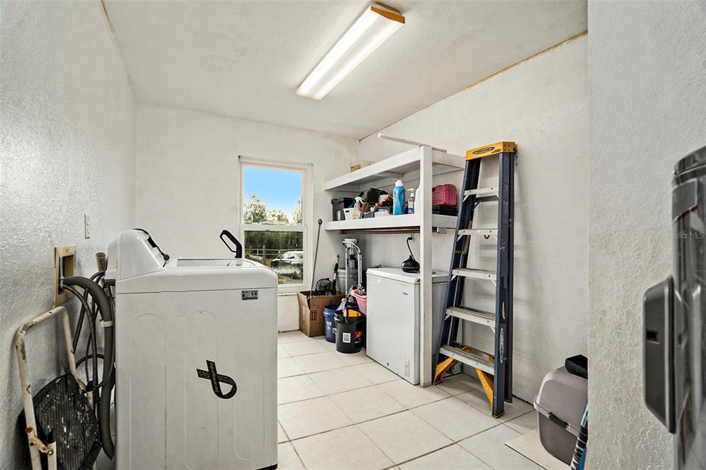 7309 Quail Meadow Road Plant City, FL 33565 - Photo 11 of 24 a view of a storage & utility room with stuff